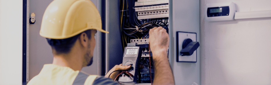 Electrician working on an electrical meter box