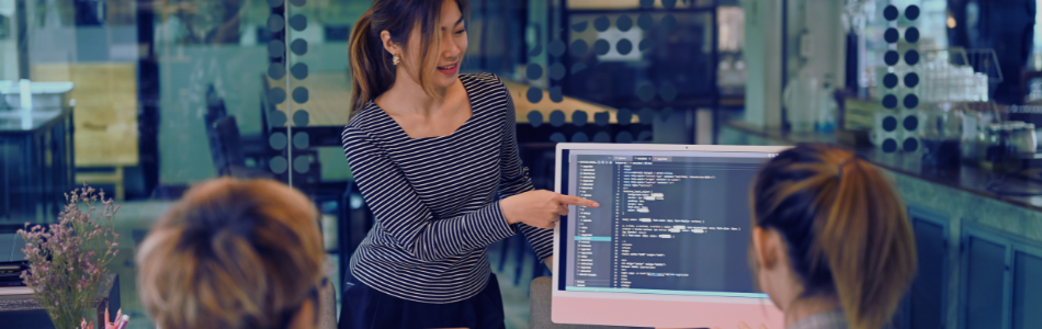 team meeting with two people facing the screen an one person presenting