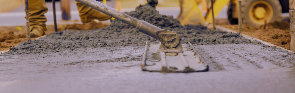 Wet concrete being poured on a construction site