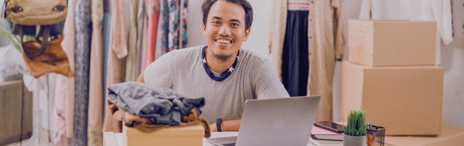 Person happily working on his clothing business