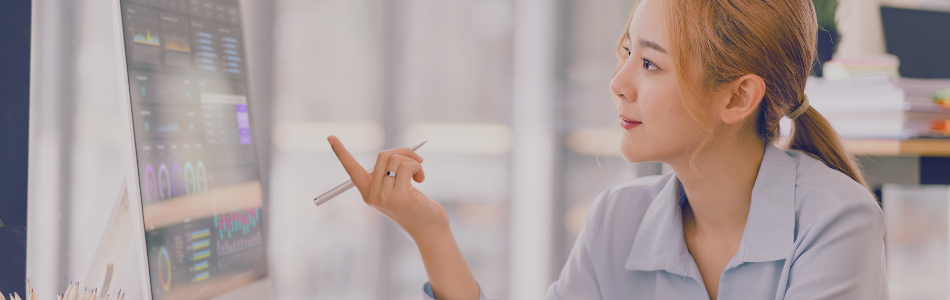 lady pointing at a computer screen